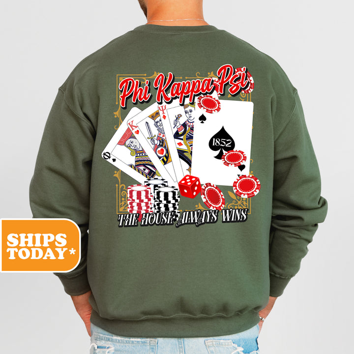 a man wearing a sweatshirt that has a picture of playing cards on it