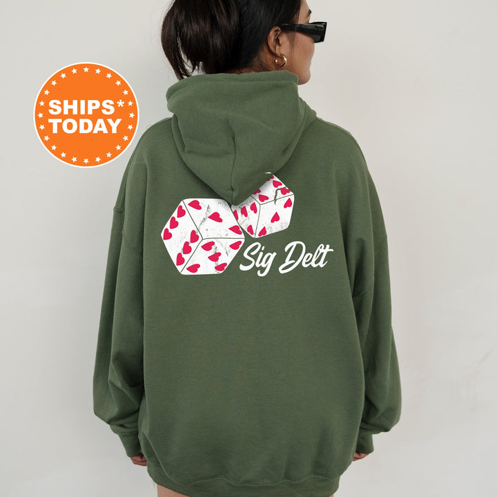 a woman wearing a green hoodie with a red and white bow on it