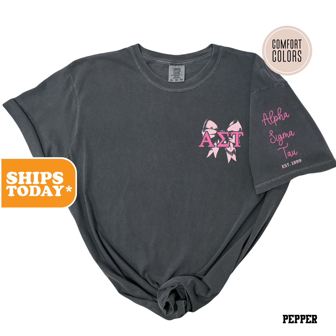 a black shirt with pink bows on it