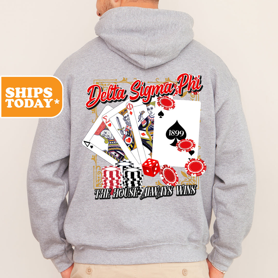 a man wearing a hoodie with a picture of playing cards on it