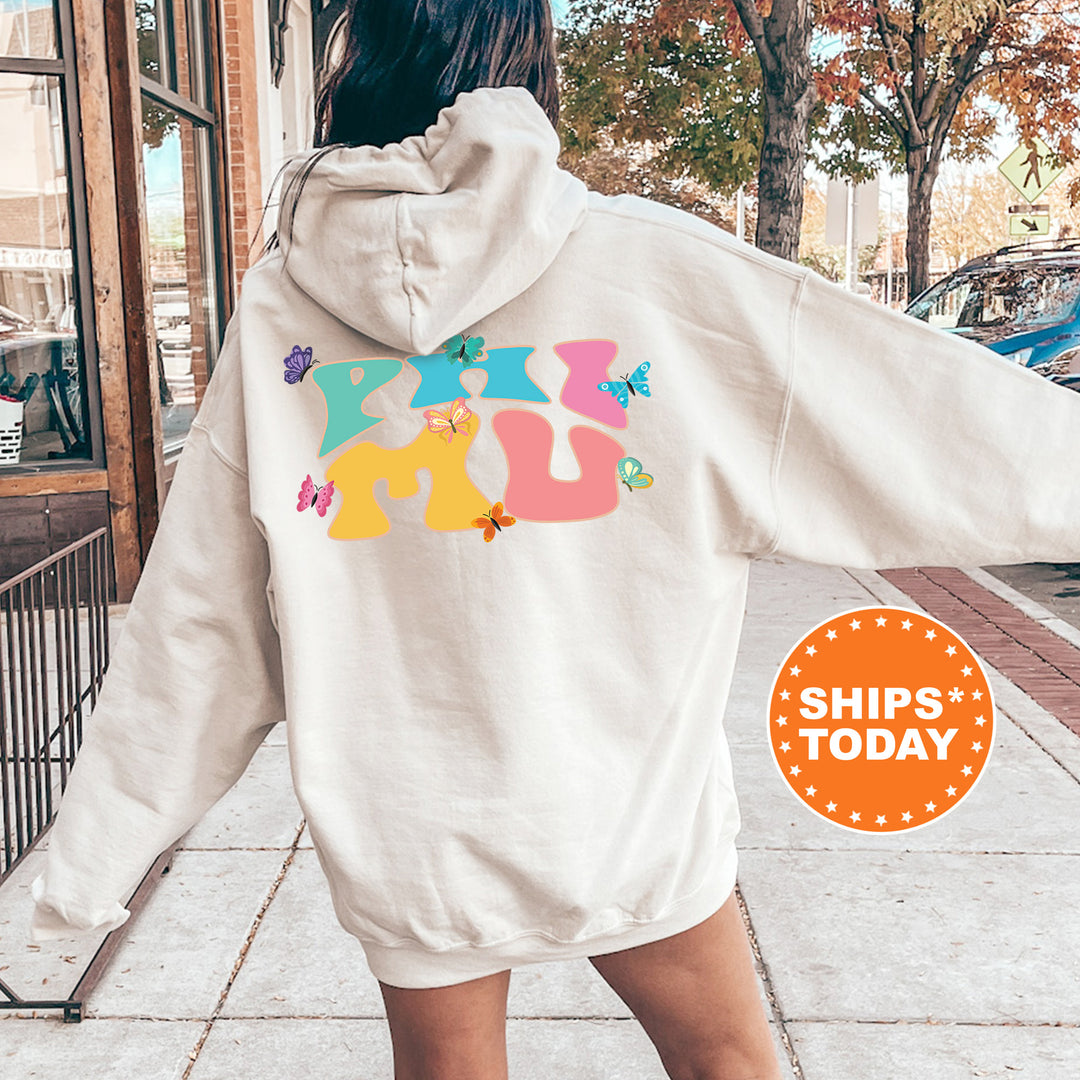 a woman walking down a sidewalk wearing a white hoodie