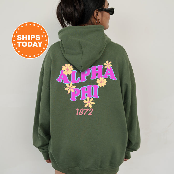 A person wearing a green hoodie with the text "ALPA Phi 1872" printed on it.