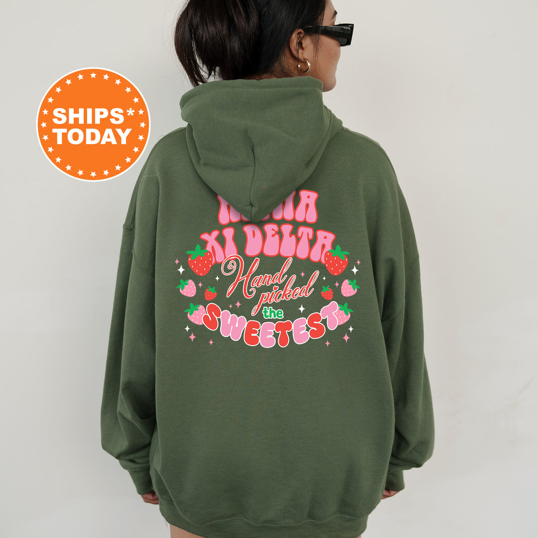 a woman wearing a green hoodie with pink writing on it