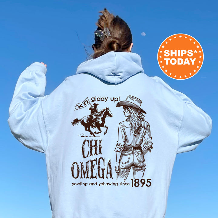 a woman wearing a white hoodie with an image of a cowboy on it