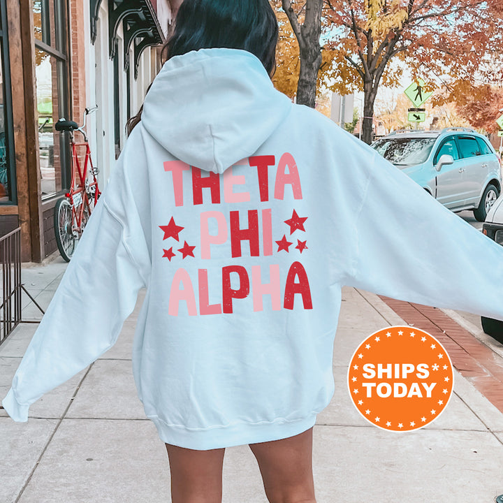 a woman in a white hoodie is walking down the street