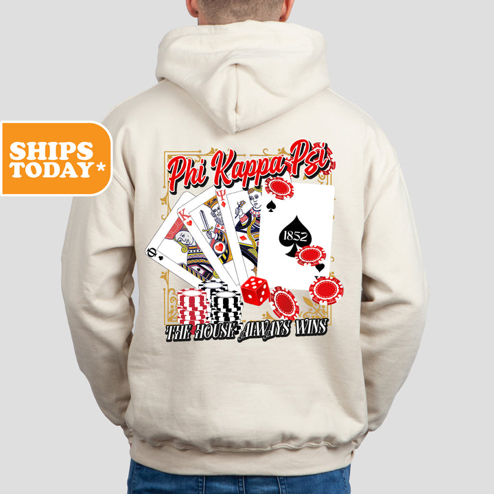 a man wearing a white hoodie with a picture of playing cards on it