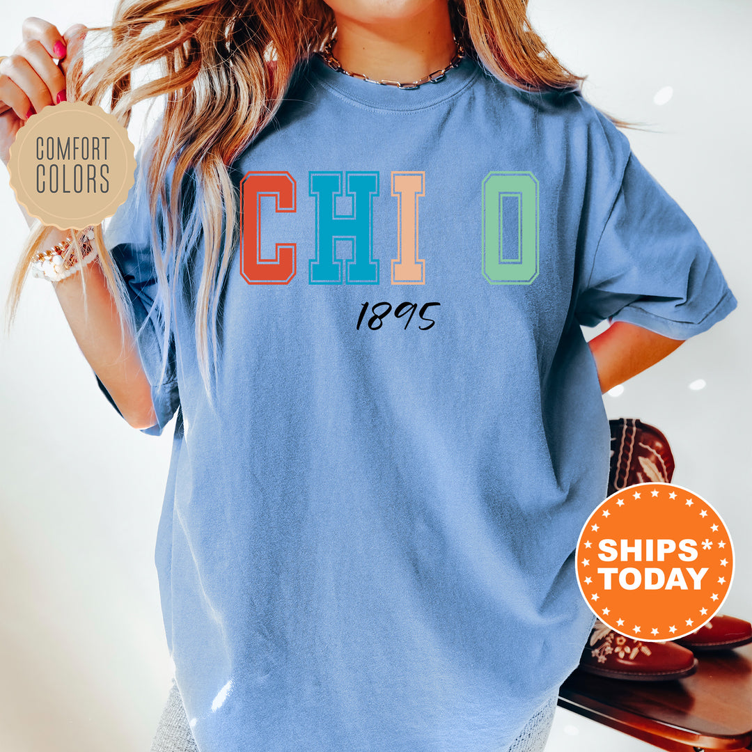 a woman wearing a blue shirt with the word chilo printed on it