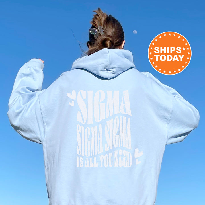 a woman wearing a white sweatshirt with the slogan stigma stigma stigma is all you need