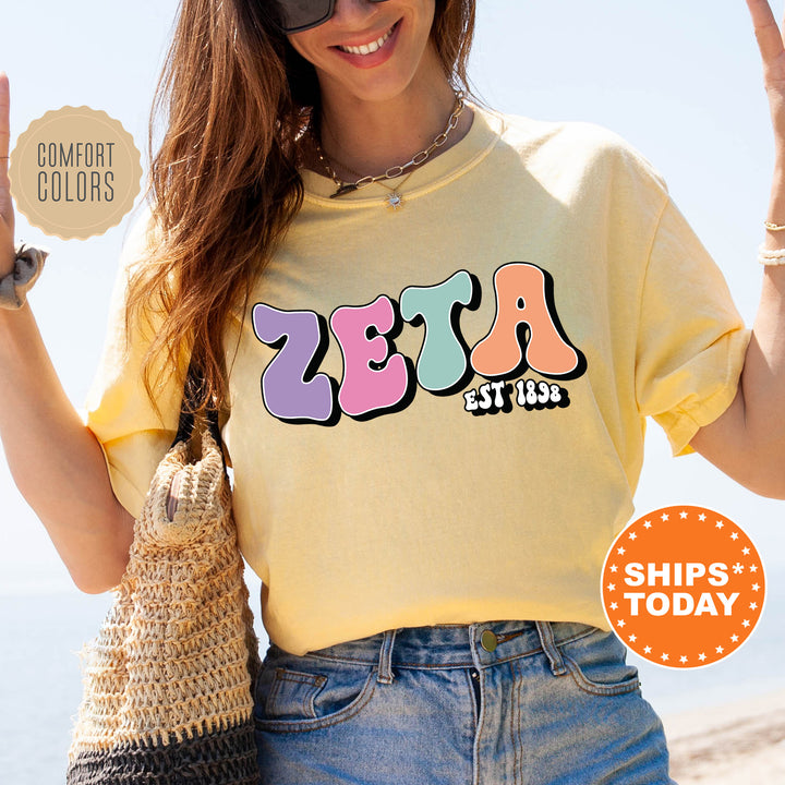 a woman in a yellow shirt holding up a peace sign