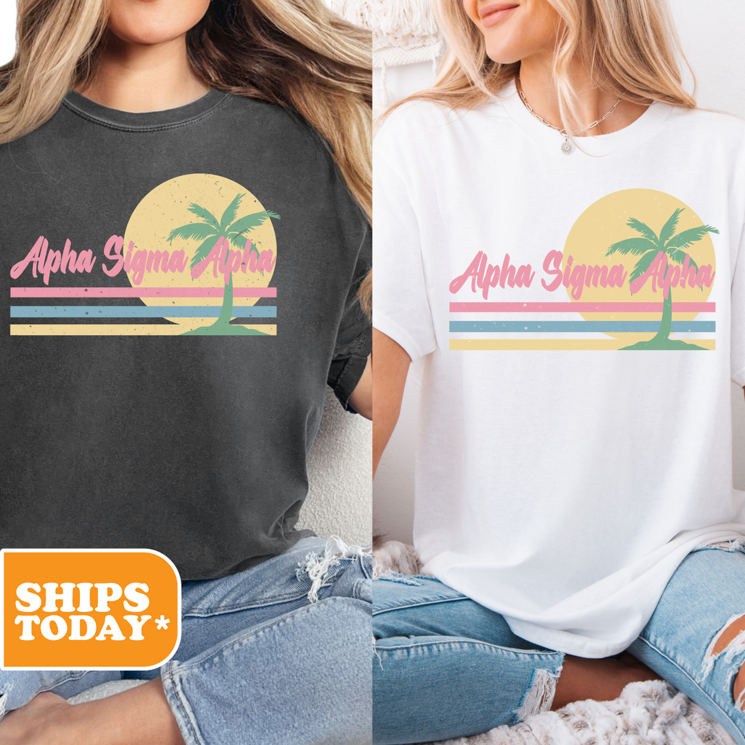 two women wearing t - shirts with palm trees on them