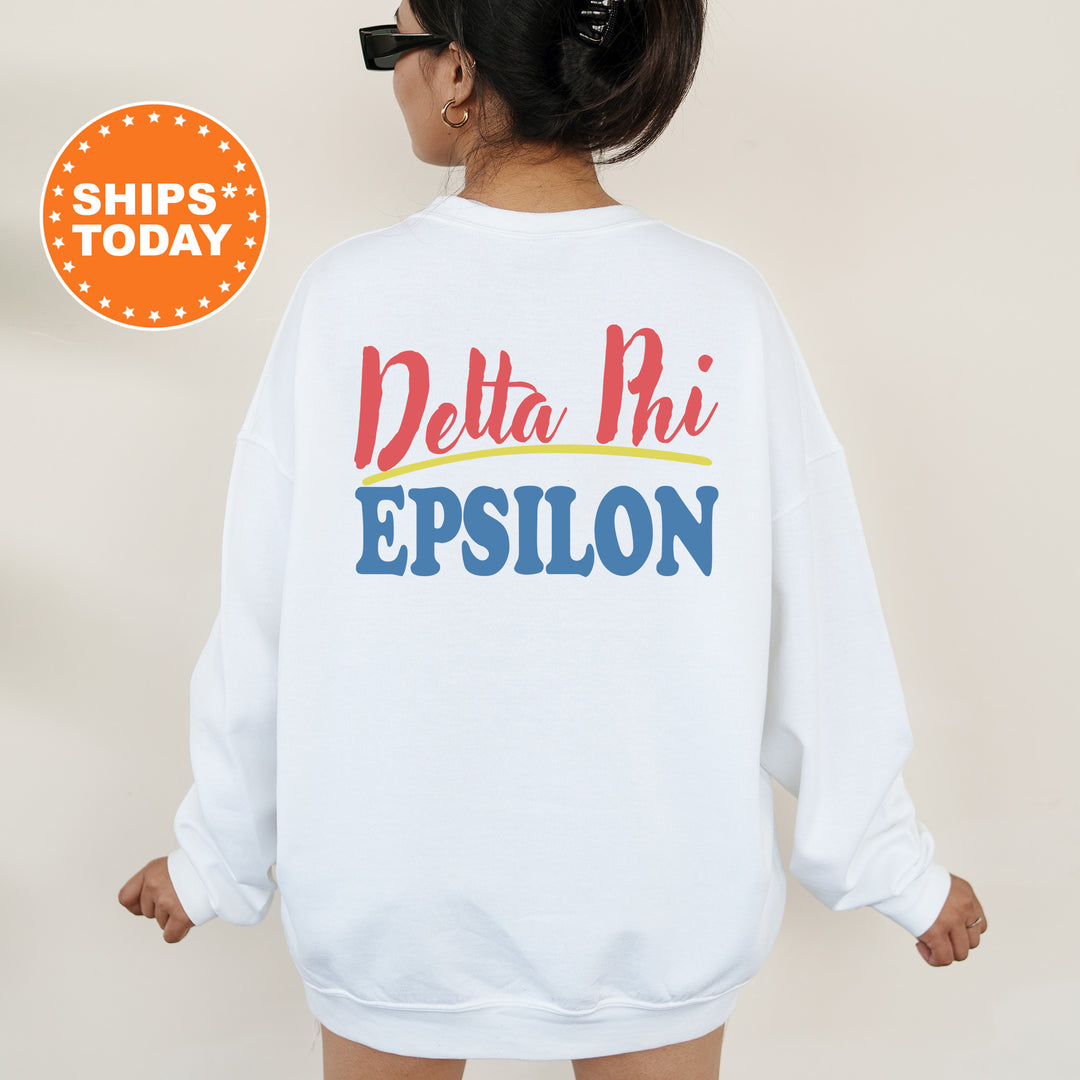 A person wearing a white sweatshirt with the text "Delta Phi Epsilon" printed on the back.