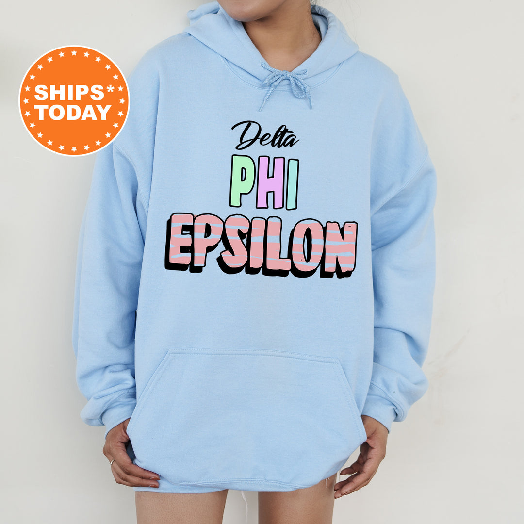 a person wearing a blue hoodie with the words phi epsilon on it