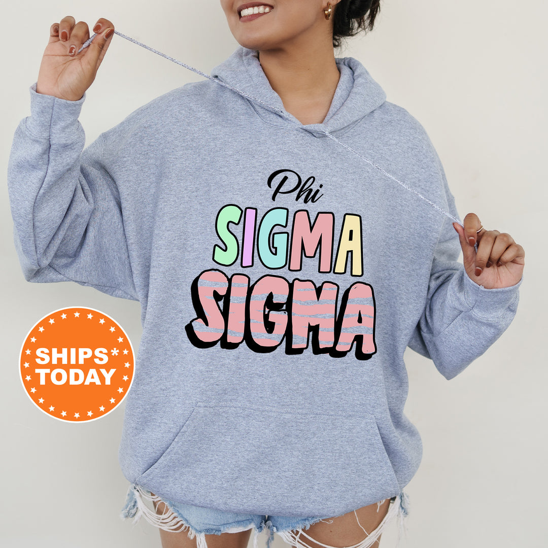 a woman wearing a blue sweatshirt with the word stigmaa on it