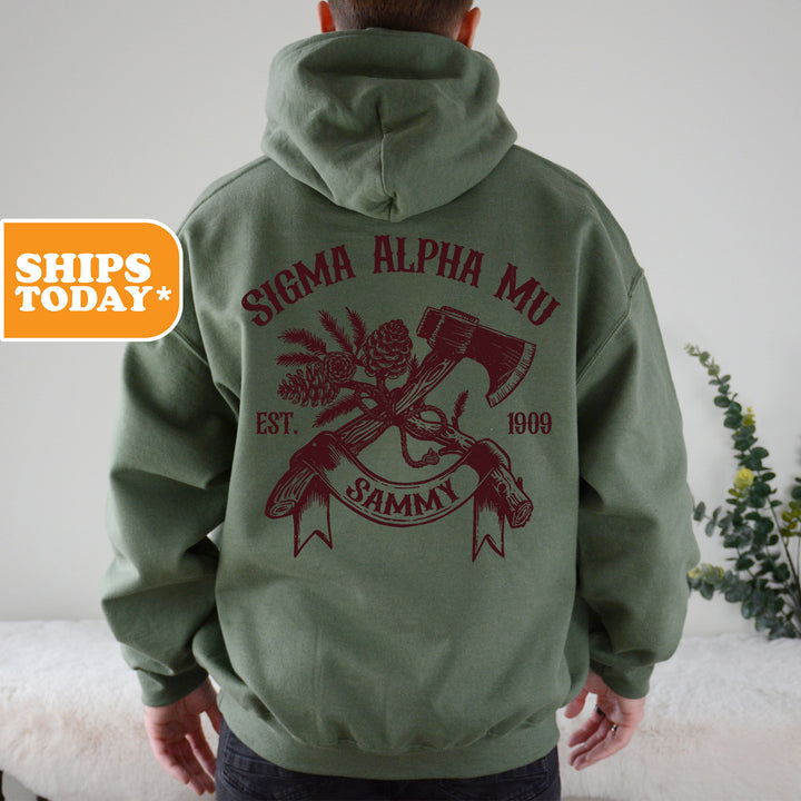 a man in a green hoodie with a hammer and skull on it