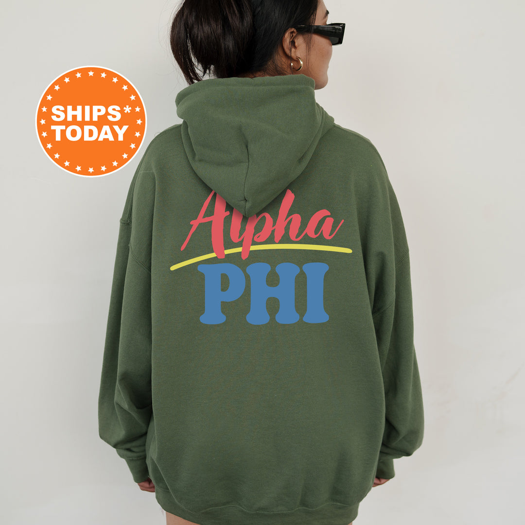 A person wearing a green hoodie with the text "Alpha Phi" printed on it.