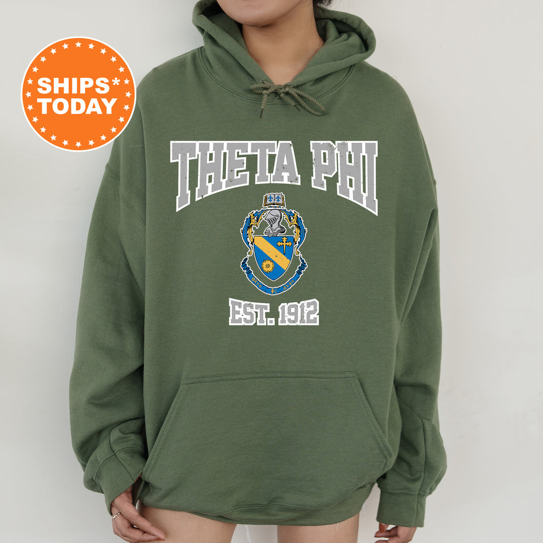 a woman wearing a green hoodie with a phi phi on it