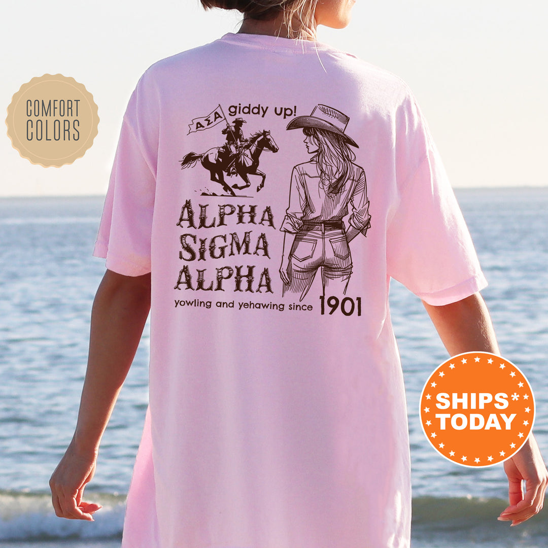 a woman wearing a pink shirt with an image of a horse and rider on it