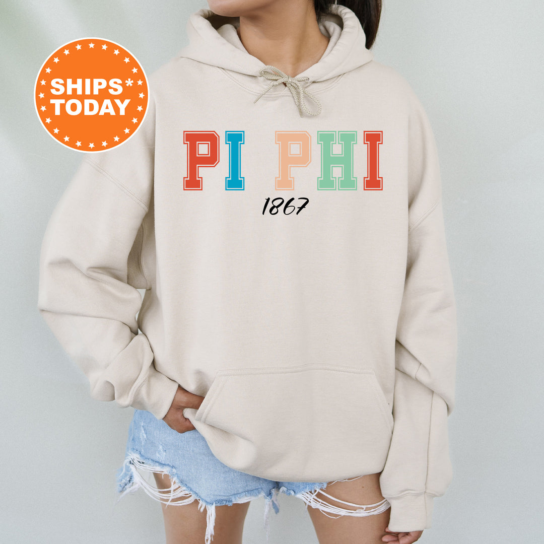 a woman wearing a sweatshirt with the word pi phi printed on it