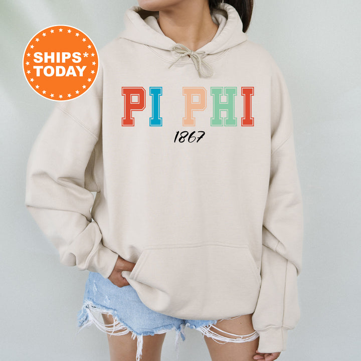 a woman wearing a sweatshirt with the word pi phi printed on it