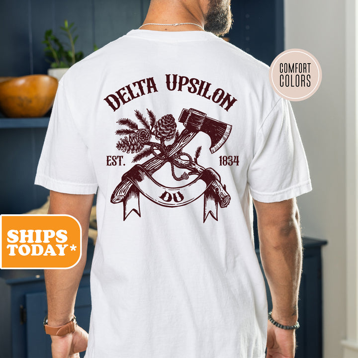 a man wearing a white t - shirt with an image of a hammer and a