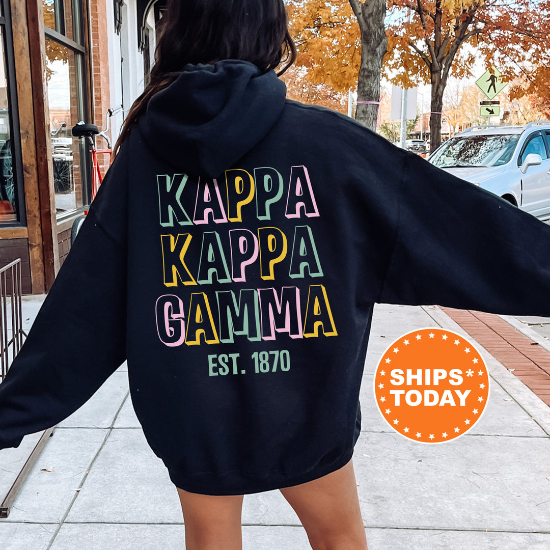 a woman in a black hoodie is walking down the street
