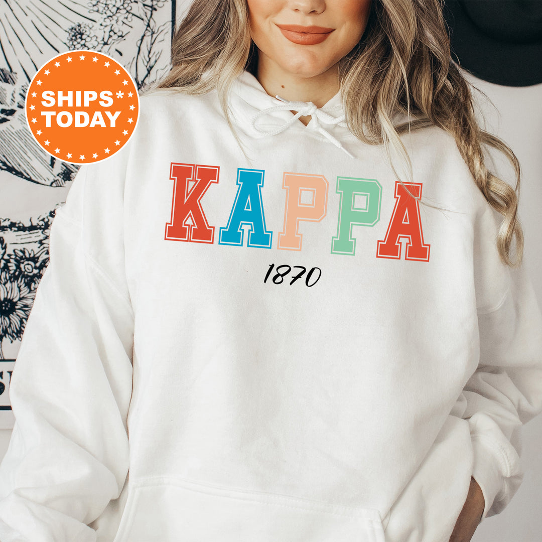 a woman wearing a white hoodie with the words kappa on it