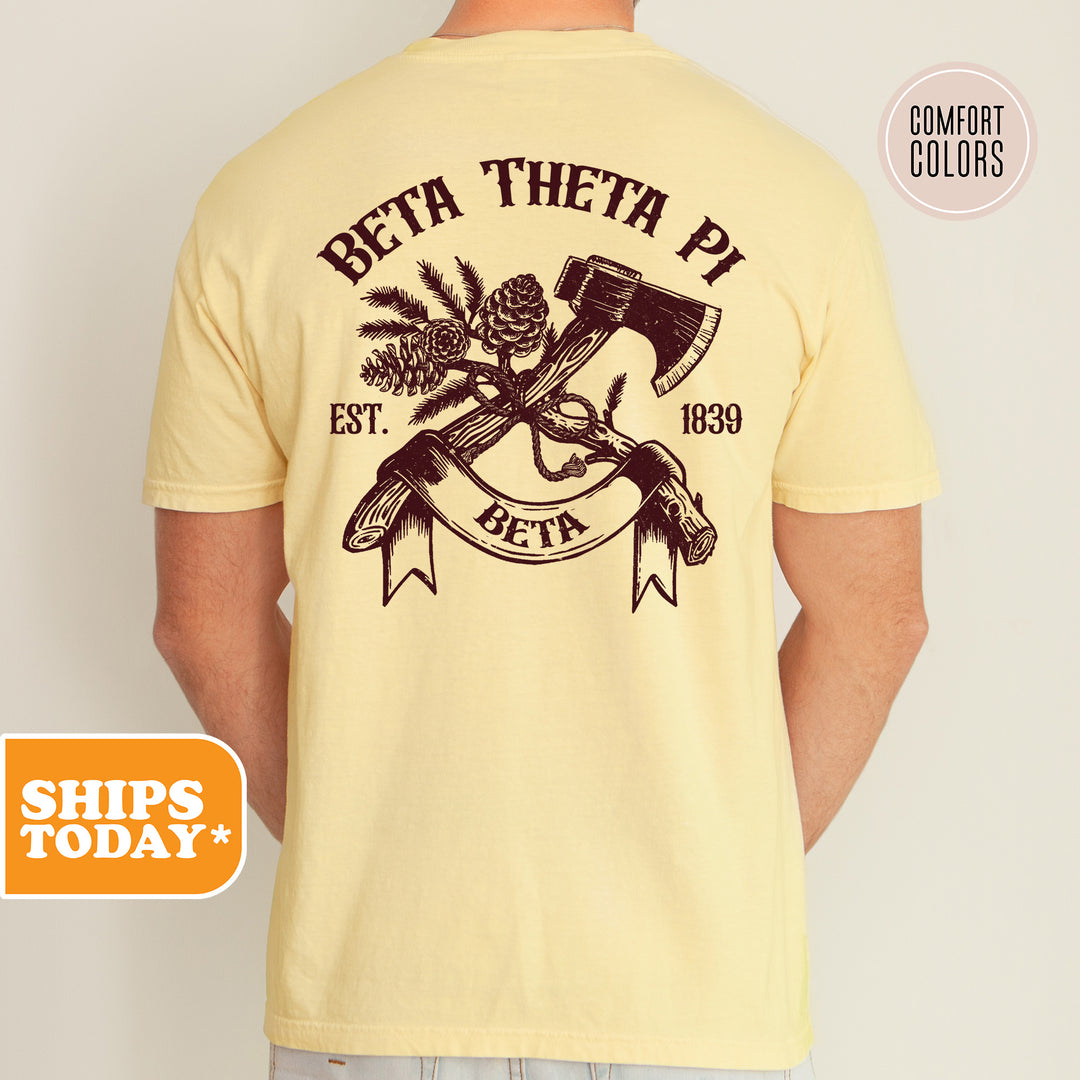 a man wearing a t - shirt with a hammer and two crossed axes on it