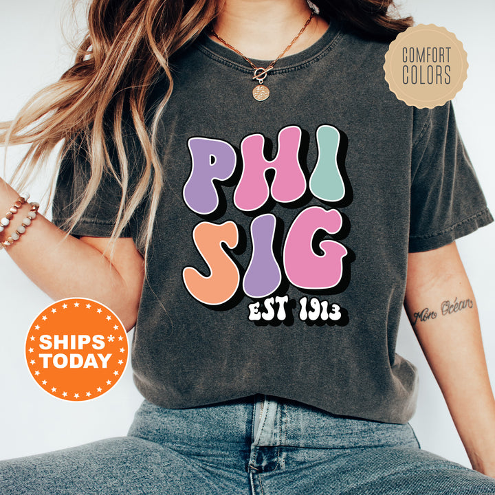 a woman wearing a shirt that says phi sig est 1915