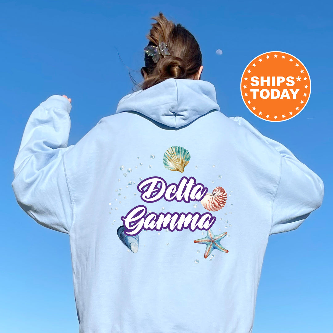 a woman with her back to the camera wearing a white hoodie