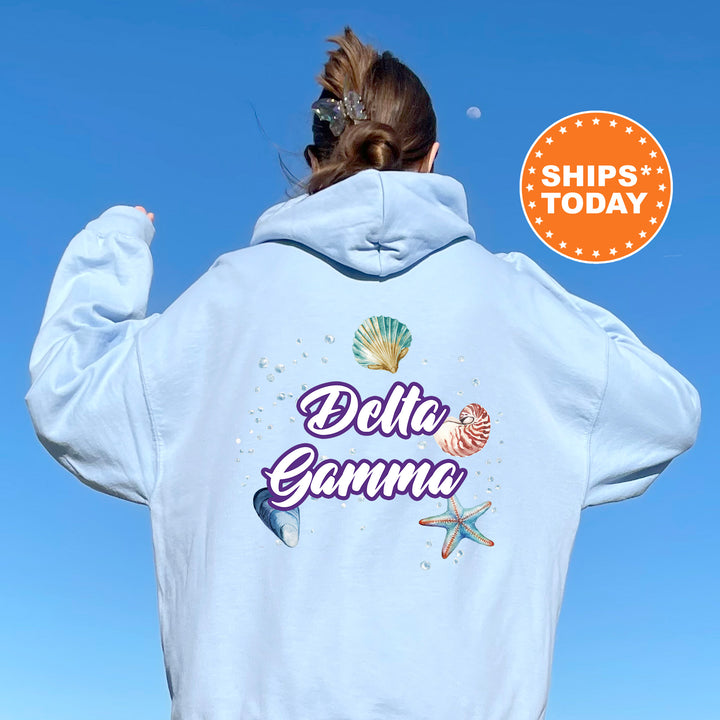 a woman with her back to the camera wearing a white hoodie