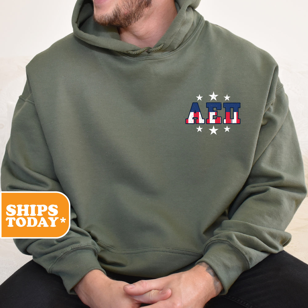 a man wearing a green hoodie with the american flag on it