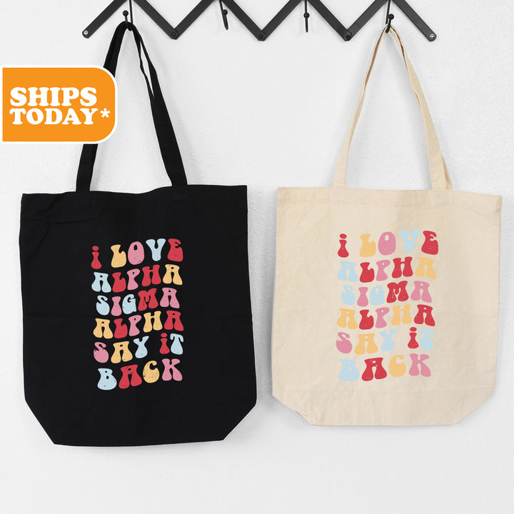 two shopping bags hanging on a wall