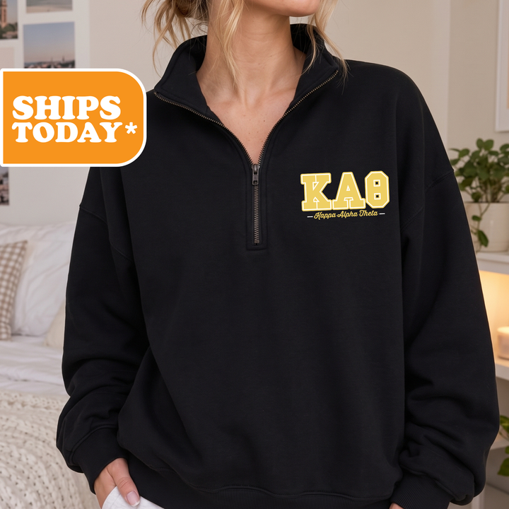 a woman wearing a black sweatshirt with a yellow kab on it