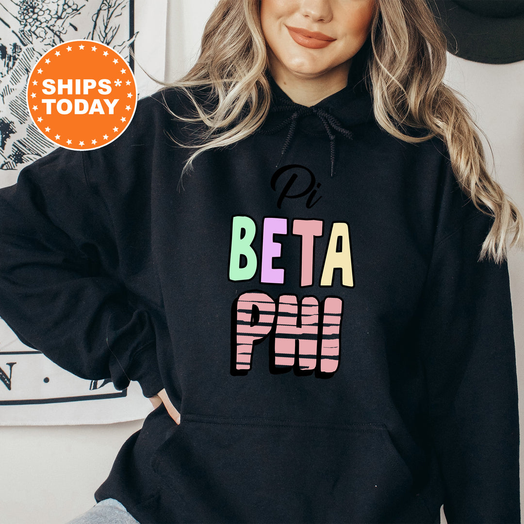 a woman wearing a black hoodie with the words beta pop printed on it