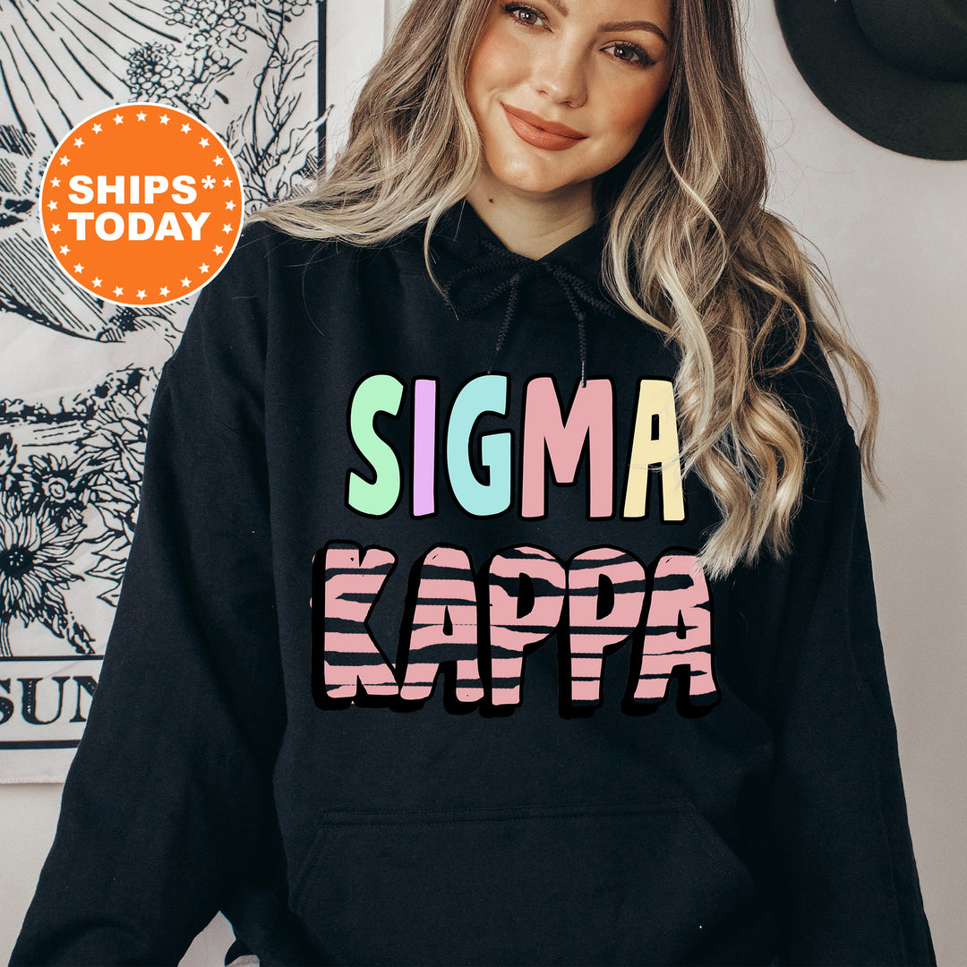 a woman wearing a black hoodie that says stigma kapa