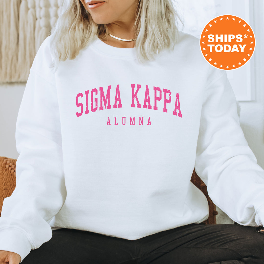 a woman sitting on a chair wearing a white sweatshirt