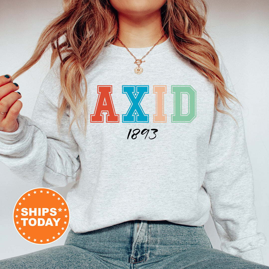 a woman wearing a sweatshirt with the word axid printed on it