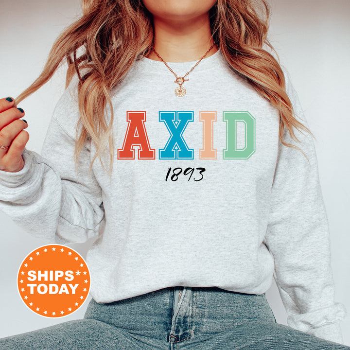 a woman wearing a sweatshirt with the word axid printed on it