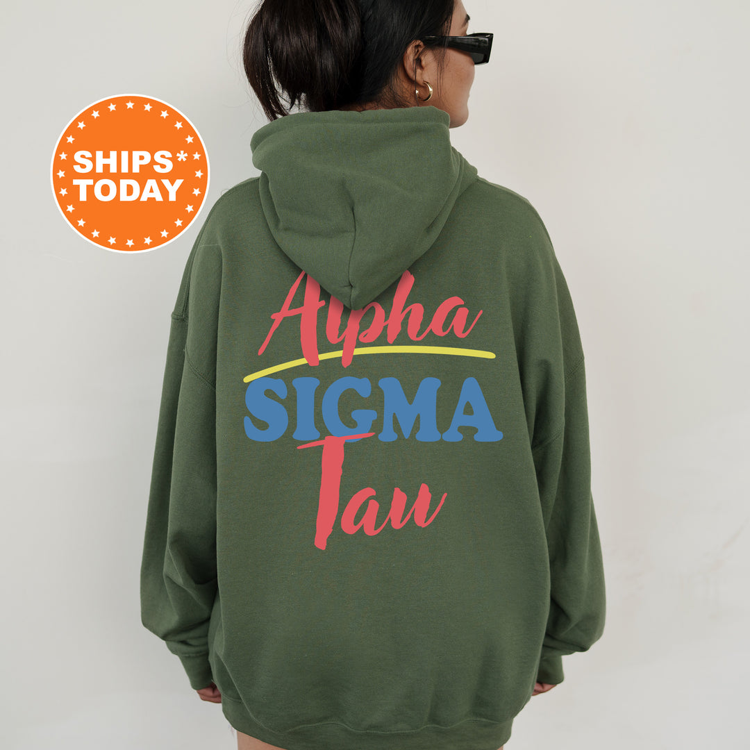 A person wearing a green hoodie with the text "Alpha Sigma Tau" printed on it.