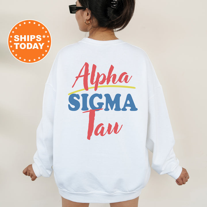 A person wearing a white sweatshirt with the text "Alpha Sigma Tau" printed on it.