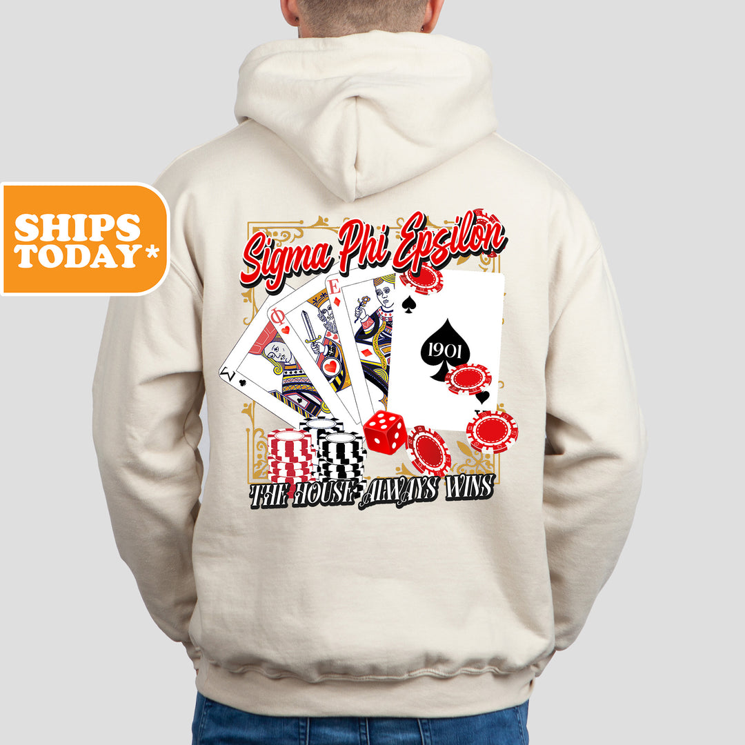a man wearing a white hoodie with a picture of playing cards on it