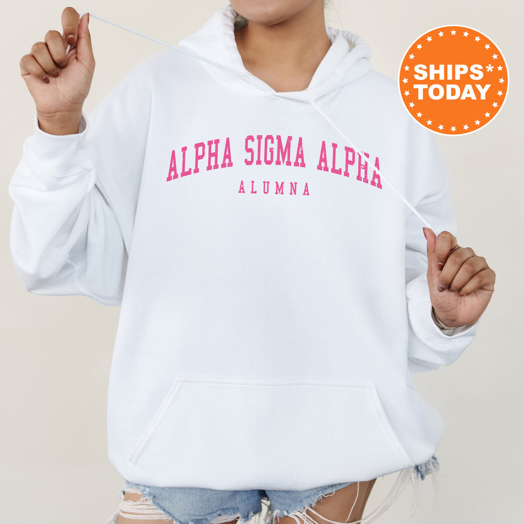 a woman wearing a white hoodie with pink letters on it