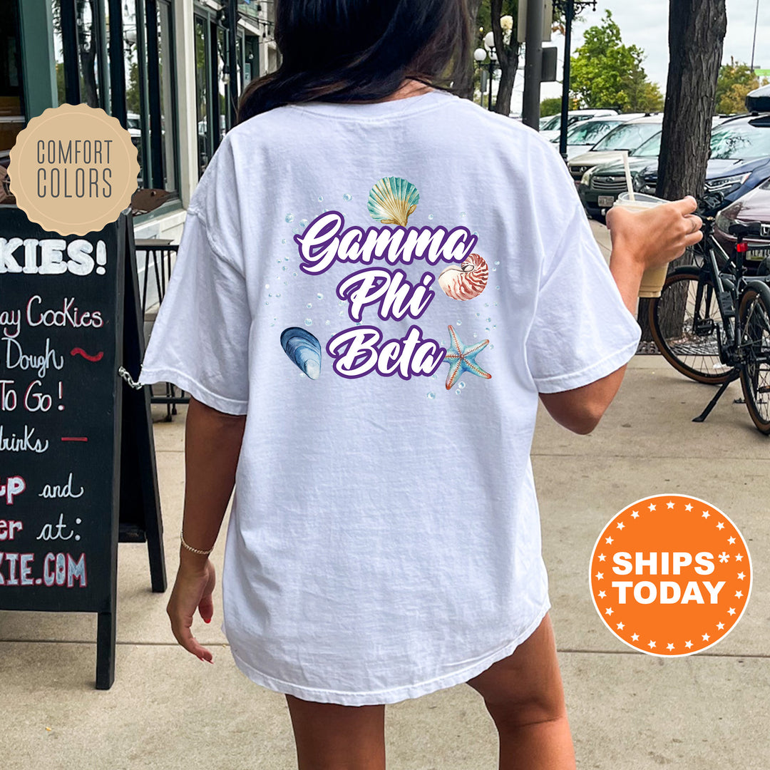 a woman walking down a sidewalk while wearing a white shirt