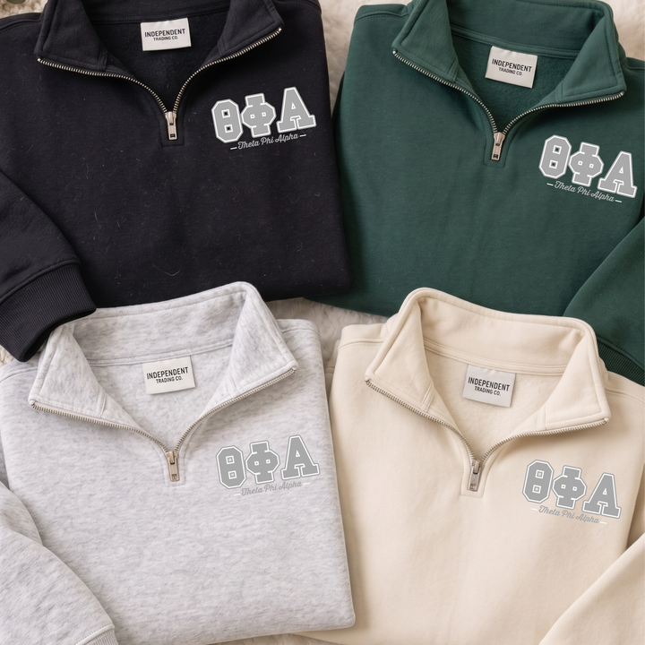 a collection of four different colored sweatshirts, each with the same logo and text on the front.