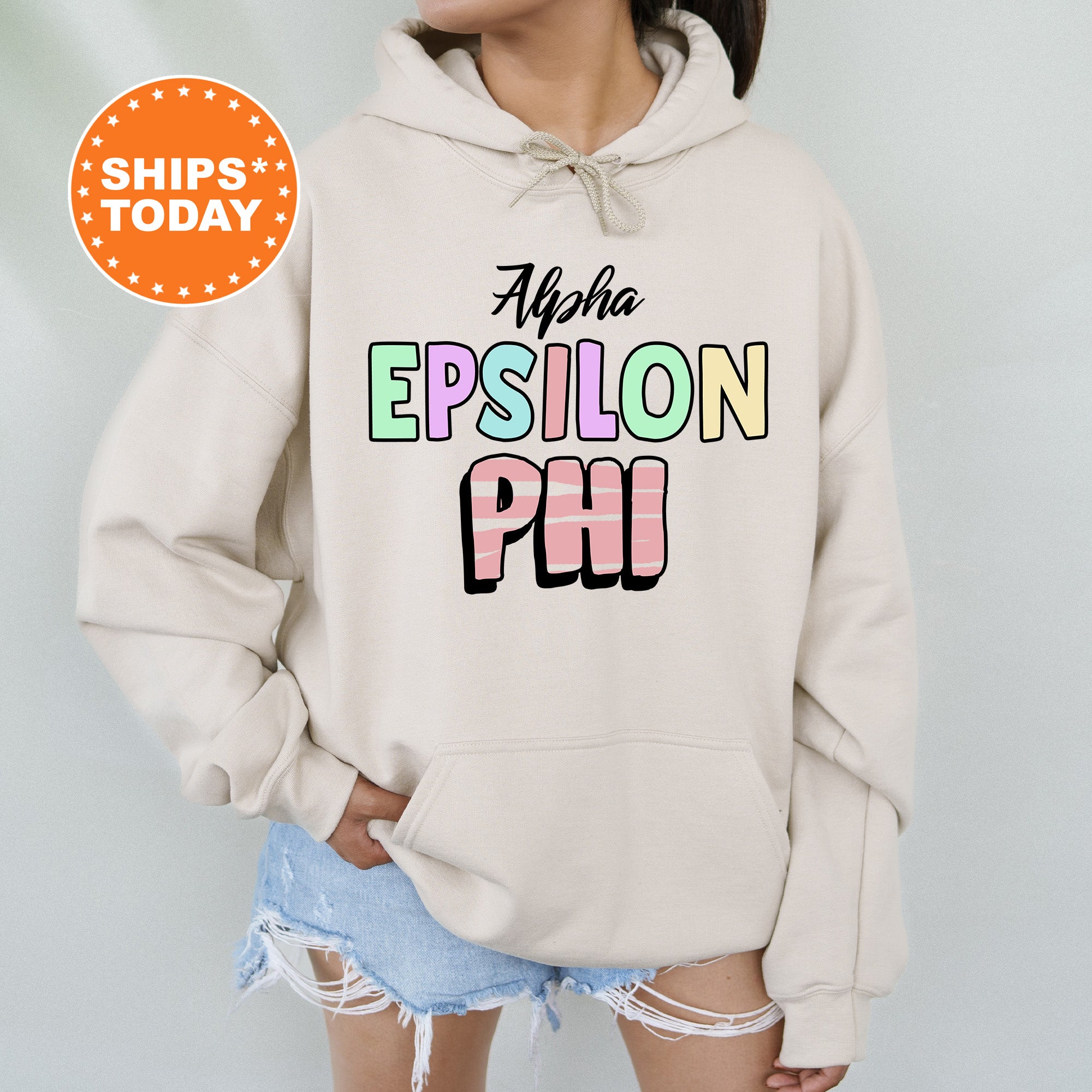 a woman wearing a white sweatshirt with the words, all you epsion phi on