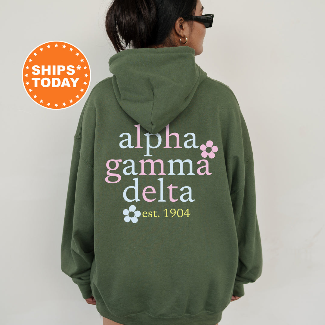 a woman wearing a green hoodie with the words aloha gamma delta