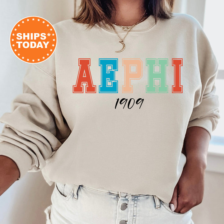 a woman wearing a sweatshirt with the word aephh printed on it