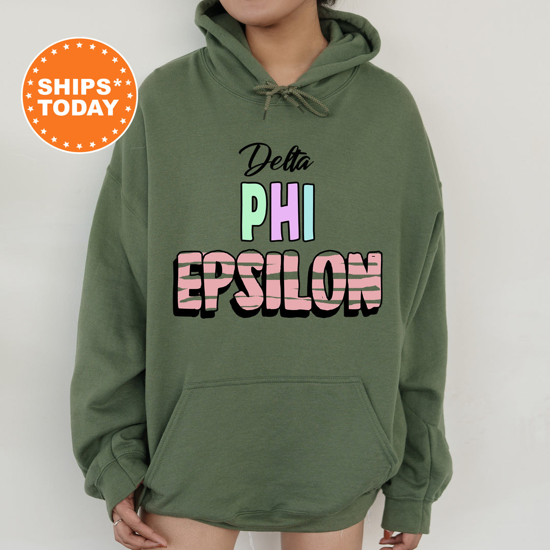 a person wearing a green hoodie that says delta phi epsilon