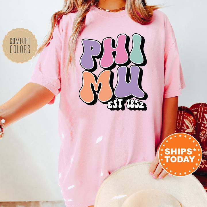 a woman wearing a pink shirt and hat