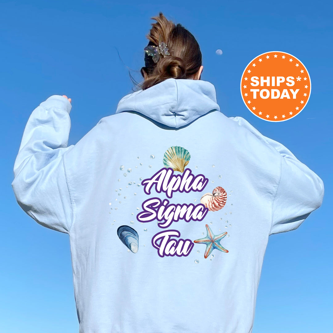 a woman with her back to the camera wearing a white hoodie